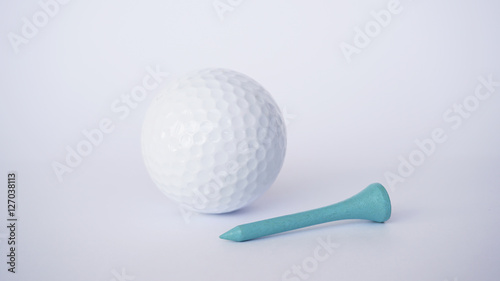 golf ball and light blue wooden golf tees on white background, sport time