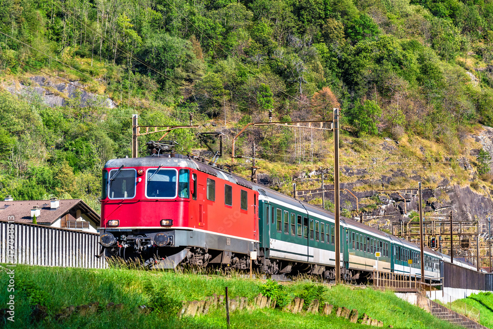 Passenger train is climbing up the Gotthard pass - Switzerland Passenger train is climbing up the Gotthard pass - Switzerland