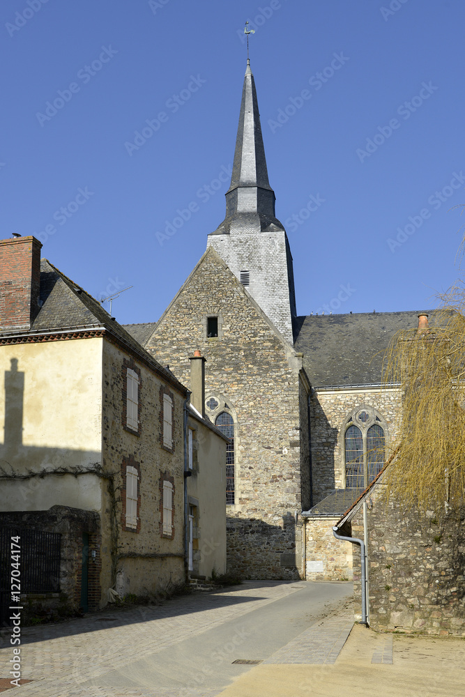 Road and church at Sainte-Suzanne, ranked one the most beautiful villages, fortified town in the Mayenne department, Pays-de-la-Loire region, in north-western France.