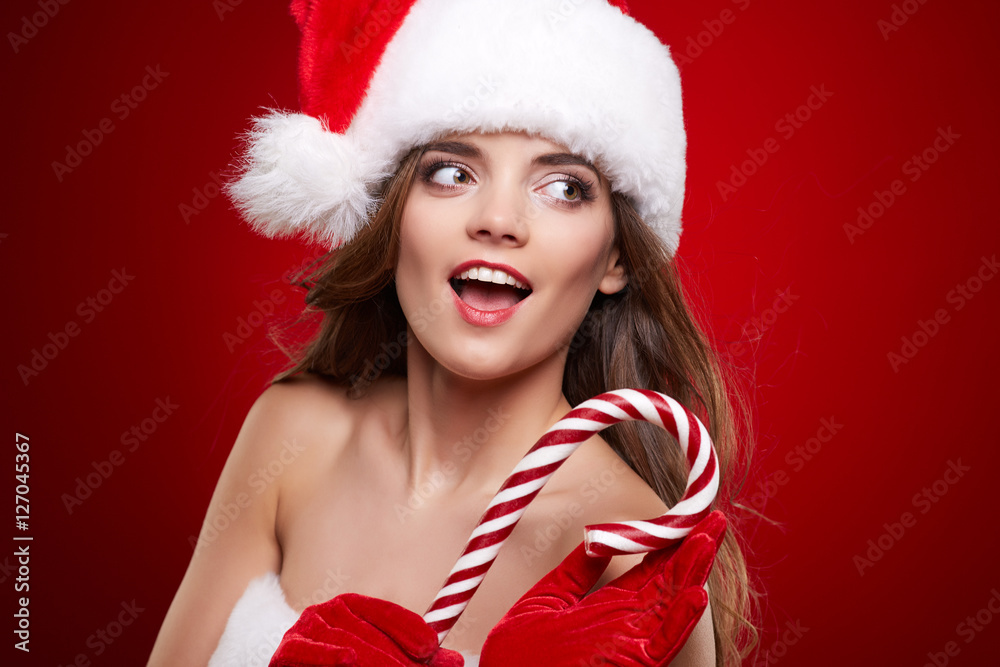 Happy smiling woman in santa claus christmas costume Happy smiling woman in santa claus christmas costume