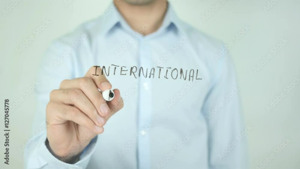International Migration, Man Writing on Screen International Migration, Man Writing on Screen