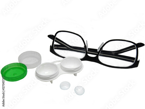 Glasses and contact lenses container on white background