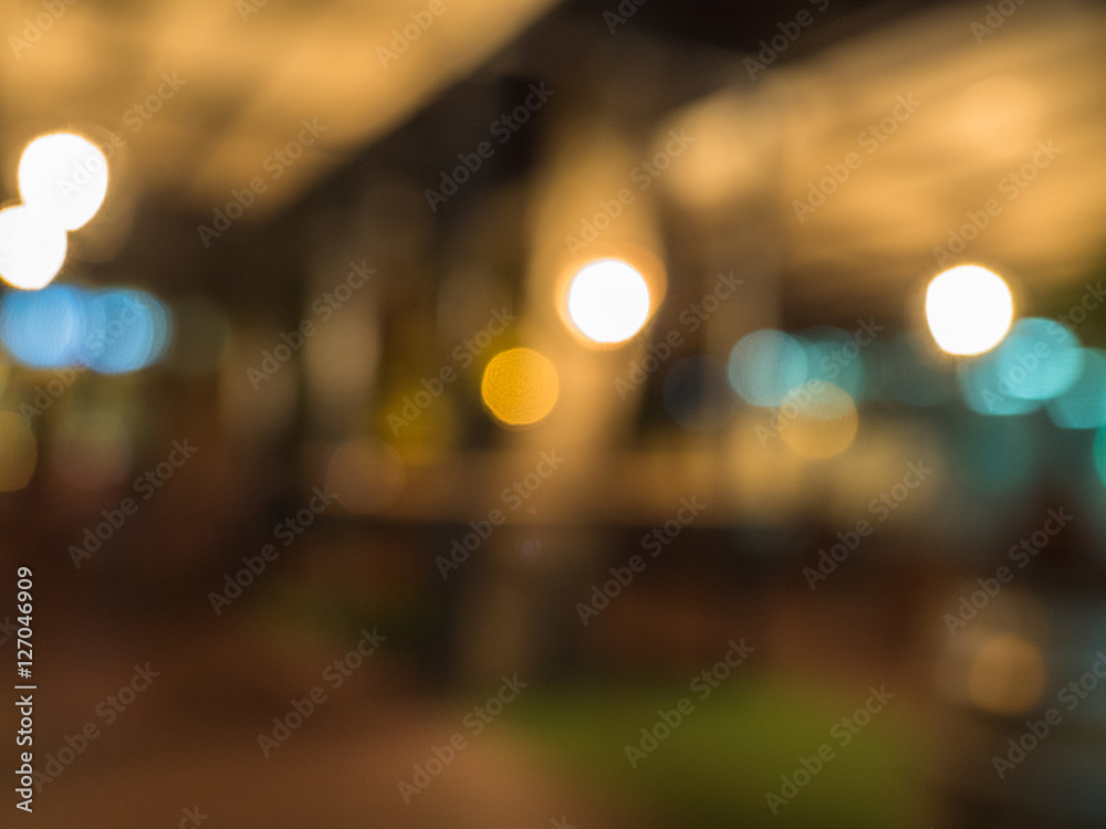 Blurred background with white, turquois and golden bokeh.