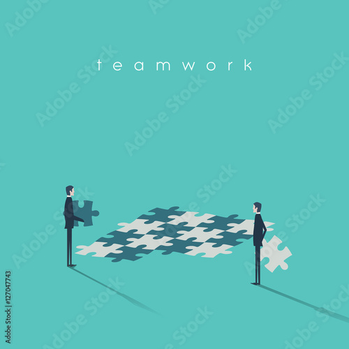 Business teamwork concept with businessmen and jigsaw puzzle as symbol of collaboration.