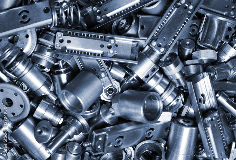 Parts of old disassembled hard drives. Heap of metal springs and linear ...