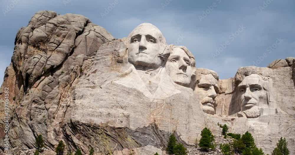 Mount Rushmore National Memorial, South Dakota, USA - granite sculpture Mount Rushmore with moving clouds, sunlight and shadows - Timelapse without motion