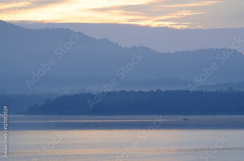 fisherman with layer mountain background