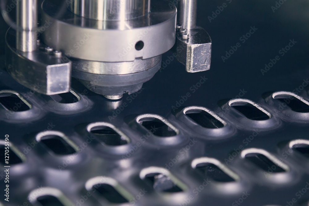Rotation CNC Punching & Nibbling Machine in Metal perforating industrial Stock Photo | Adobe Stock