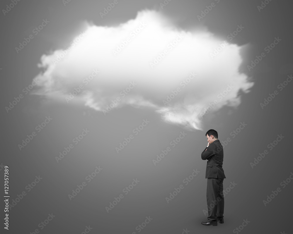 Businessman thinking about white cloud thought bubble