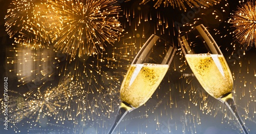 Composite image of champagne glasses clinking