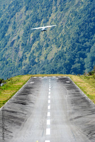 The aircraft on the runway of the Tenzing-Hillary airport Lukla - Nepal, Himalayas.