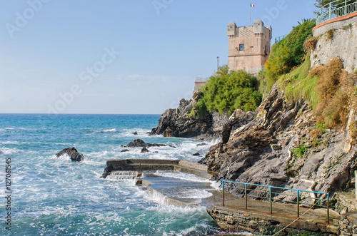 Tower of Gropallo over the rocky cliffs at the Nervi seaside promenade, Passeggiata Anita Garibaldi, in Genoa, Italy