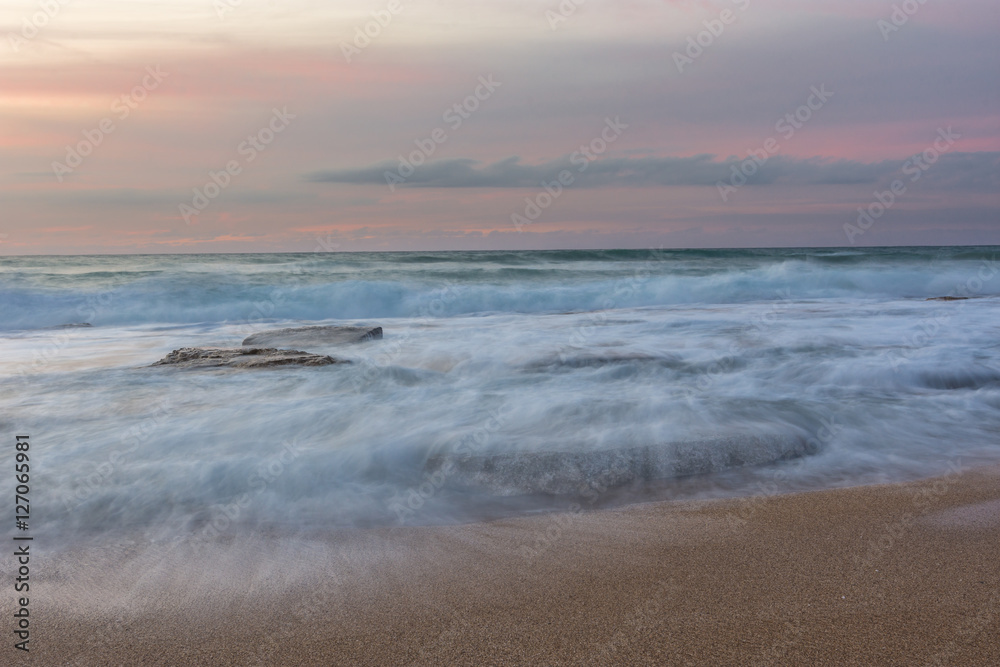 silky water of a rough sea after sunset