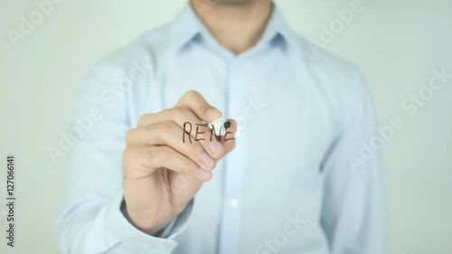 Renew, Man Writing on Screen photo