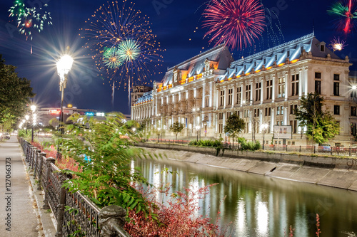 Center of Bucharest with fireworks in the sky.