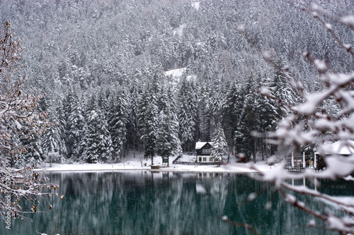 It snows on mountain lake photo