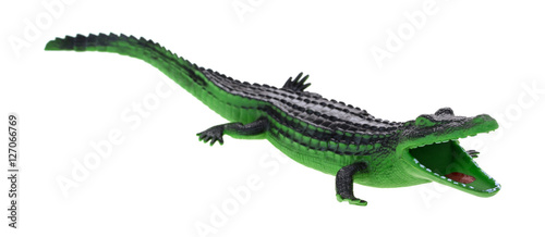 Toy alligator with open mouth isolated on a white background. © Bert Folsom