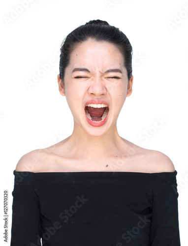 Asian woman screaming loudly isolated on white