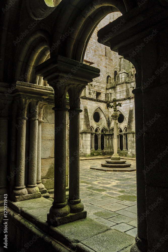 sight of the columns of the gallery of the cloister of the Romanesque cathedral of Oporto, Portugal