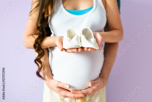 Family photo expecting a baby