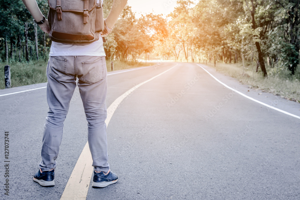 Asian man with backpack on nature background ,alone and wait hipster tone Asian man with backpack on nature background ,alone and wait hipster tone