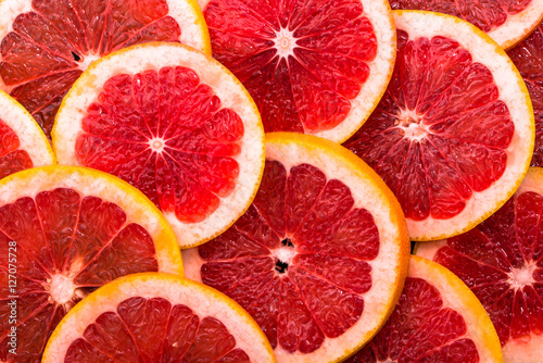 Macro of grapefruit slices, texture of citrus, close up, overhead view