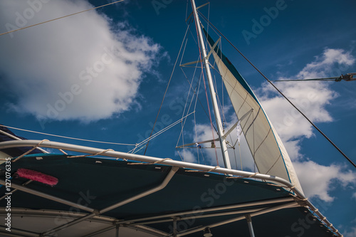 catamaran view from a low angle with background of sky and clouds