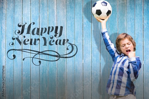 Composite image of child with soccer ball