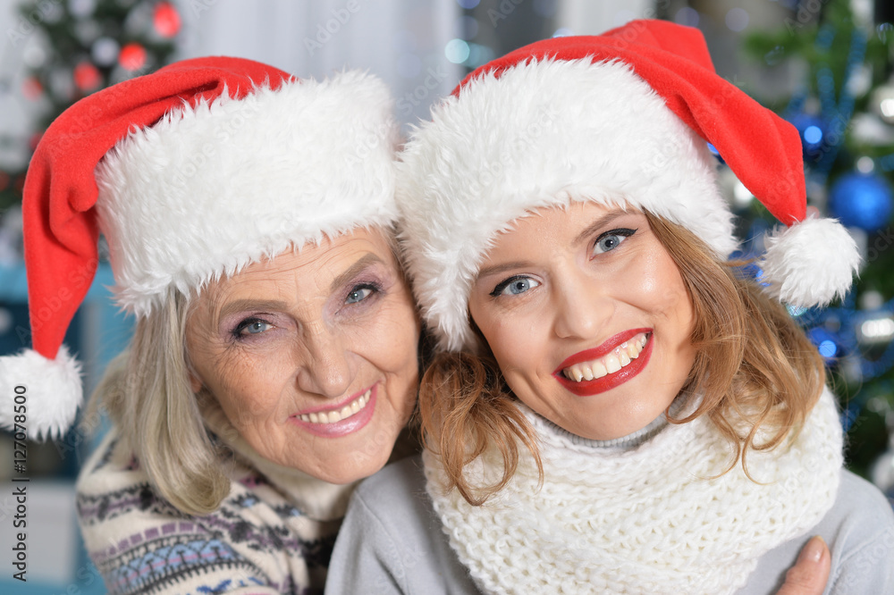 Two women in santa hats Two women in santa hats