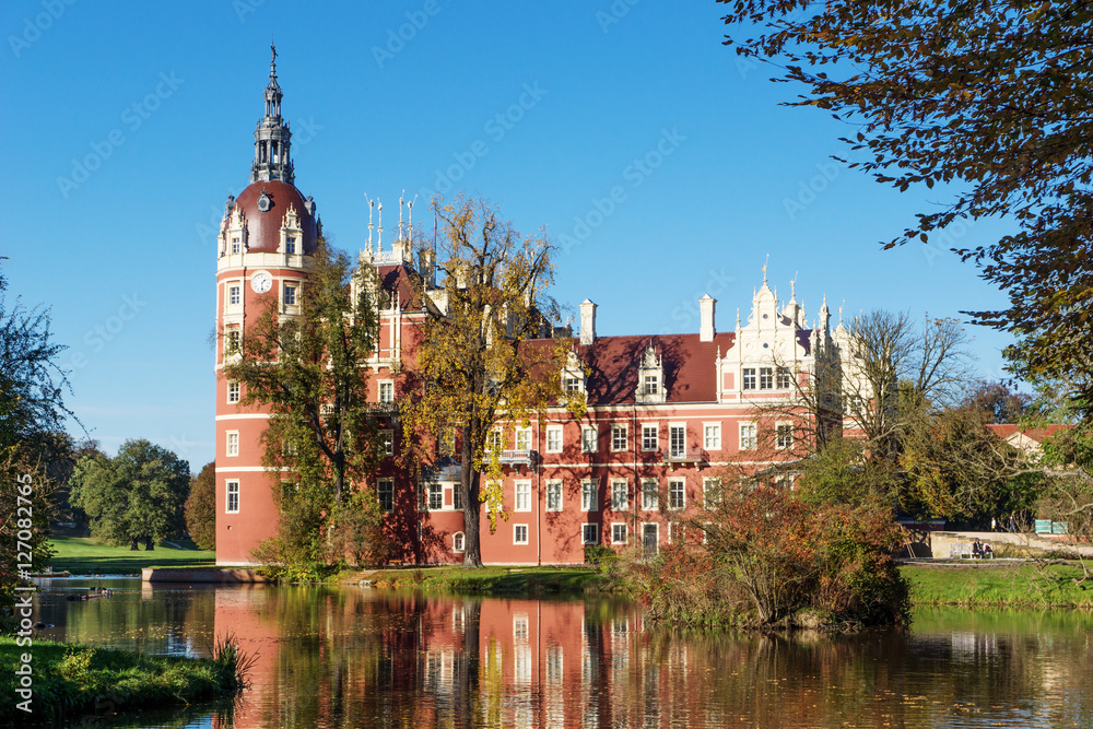 Muskau Palace reflected in the lake in the Lusatia, Germany