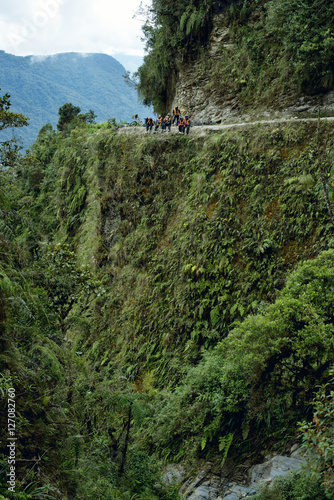 Cyclists sitting down on the Death Road - the most dangerous road in the world, North Yungas, Bolivia