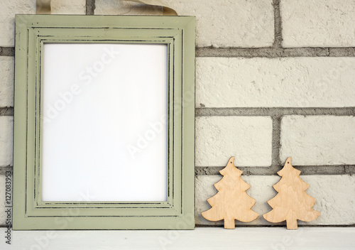 Christmas and New Year background. Empty picture frame, fir with with copy space blank tag on white background. Copy space image. Scandinavian style home interior decoration
