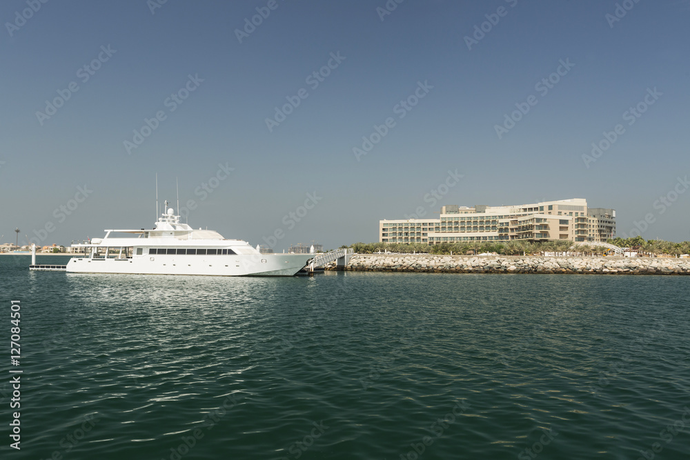 Luxury yacht and scyscrapers in center of Dubai, Unidet Arab Emirates.