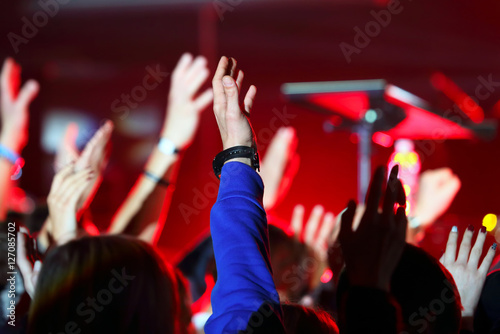 people raised their hands at the event