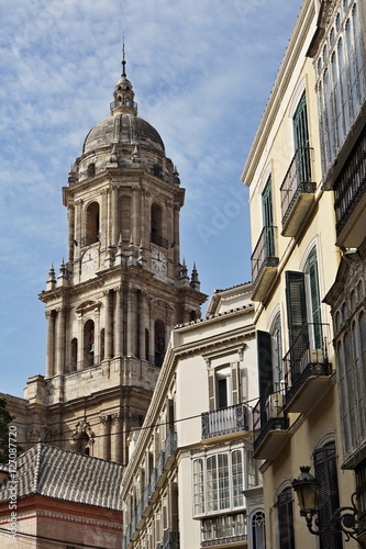 Top of the church in Granada in southern Spain as a typical Spanish bell tower, symbol of Spanish religious architecture and design 