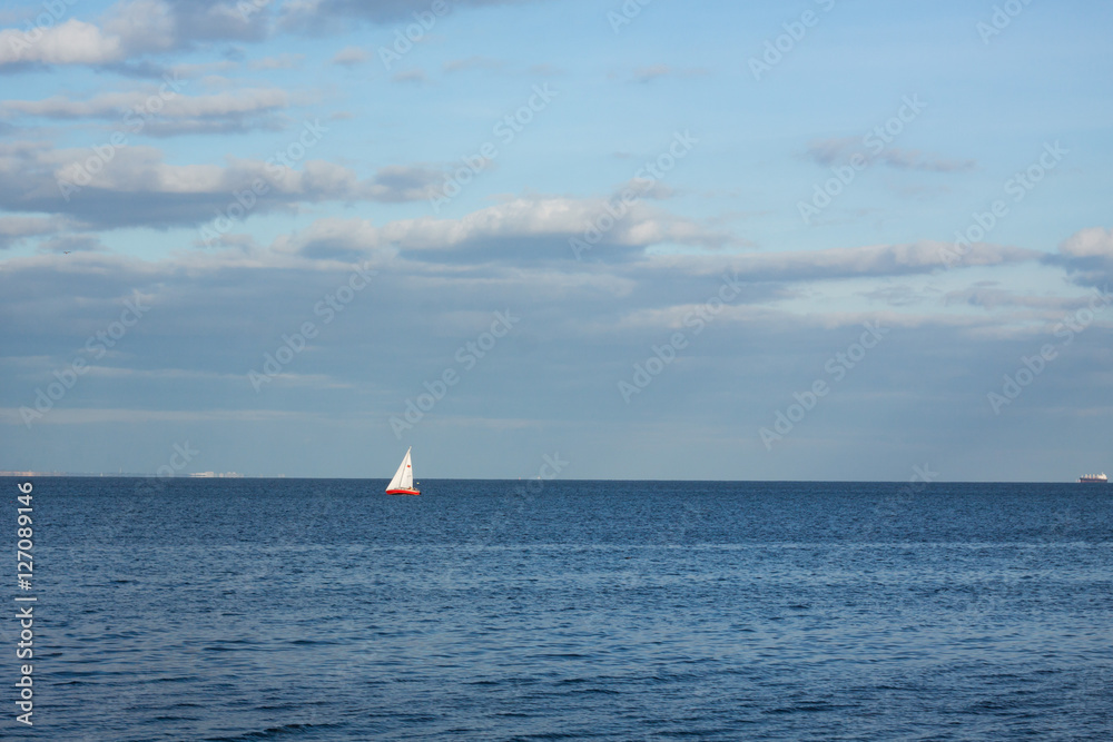 minimalistic sea landscape with sailing boat