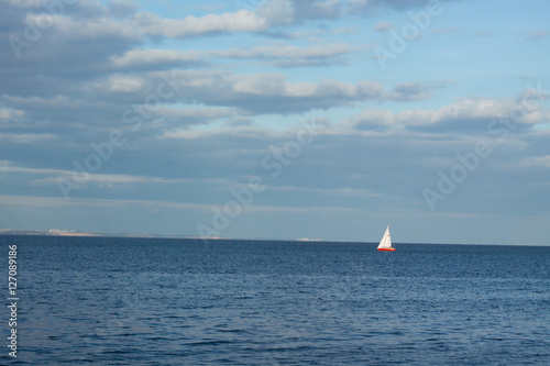 minimalistic landscape with sailing boat