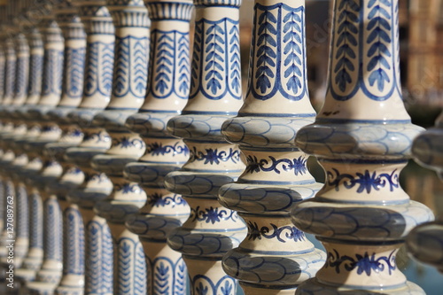 Detail of a ceramic decorated railing (handrail) in Sevilla (Seville) in Southern Spain in front of the famous Plaza de Espana  photo