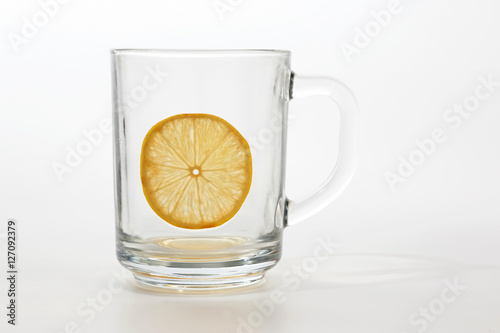 empty transparent cup of tea with lemon