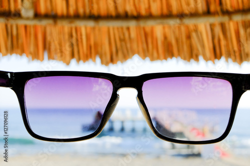 Sunglasses at sea background