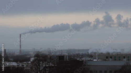 Power plant. Smoke from chimney. Frosty winter morning.