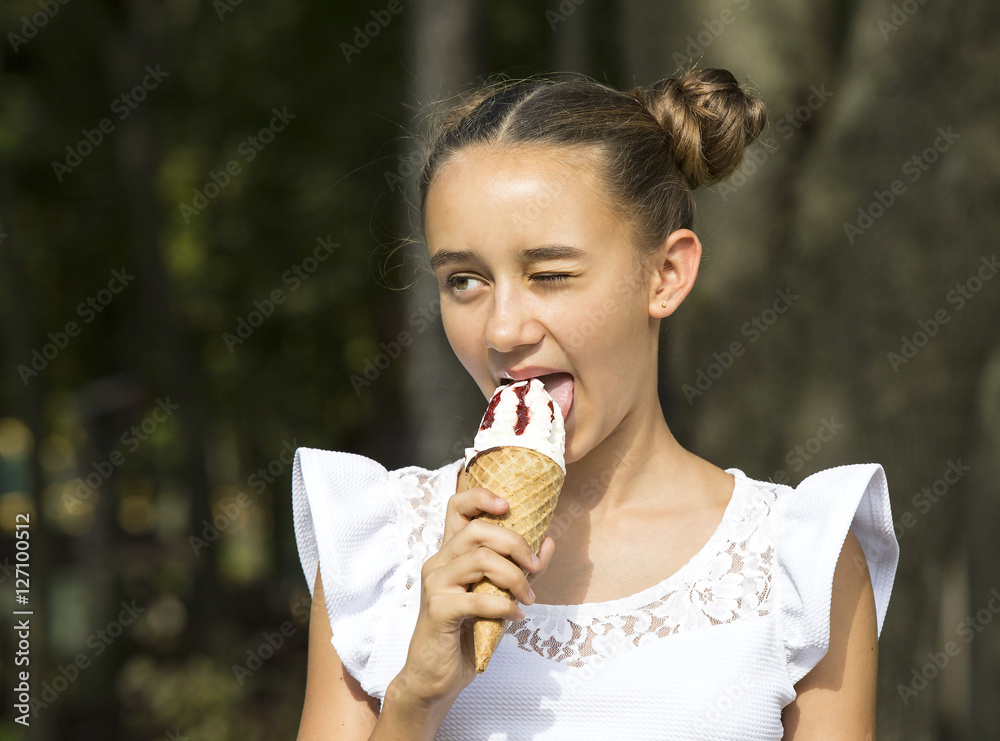 Girl eating ice cream in the park Girl eating ice cream in the park