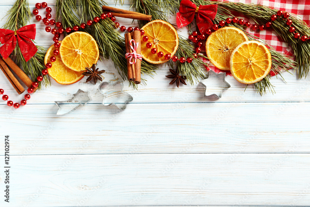 Christmas tree branch with dried oranges, cinnamon and anise sta
