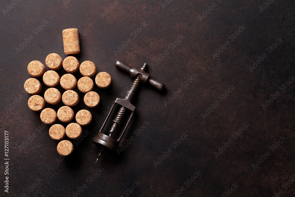 Vintage corkscrew and wine corks