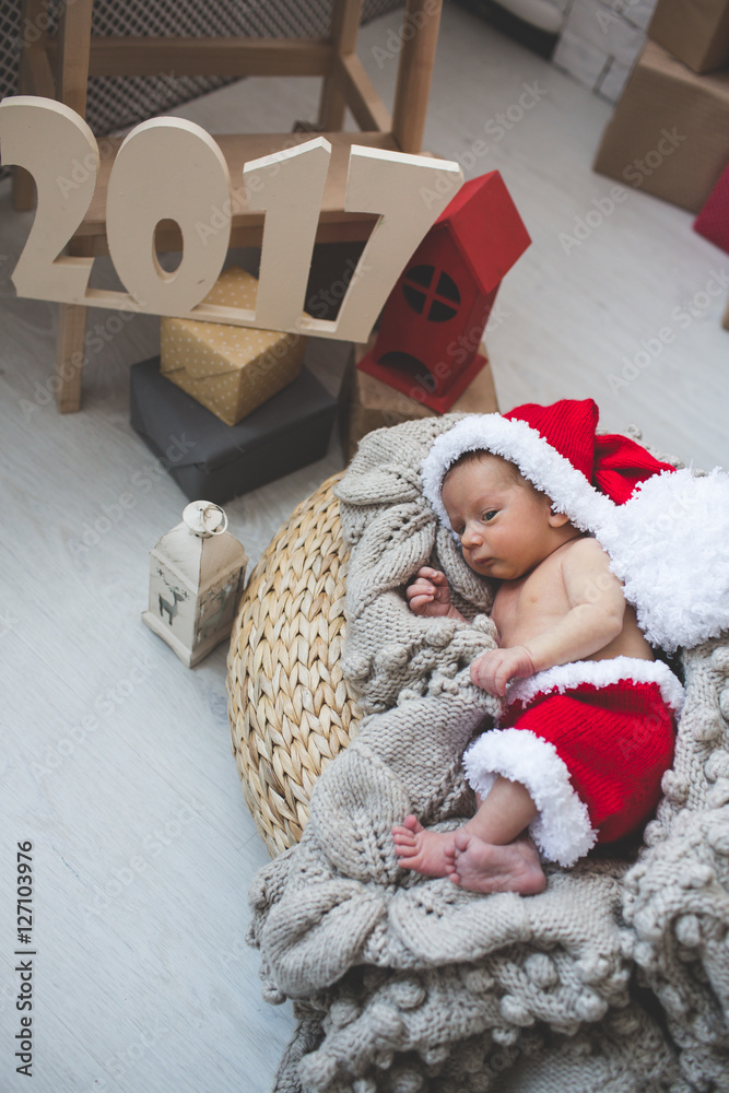 Obraz premium Newborn baby in Santa clothes