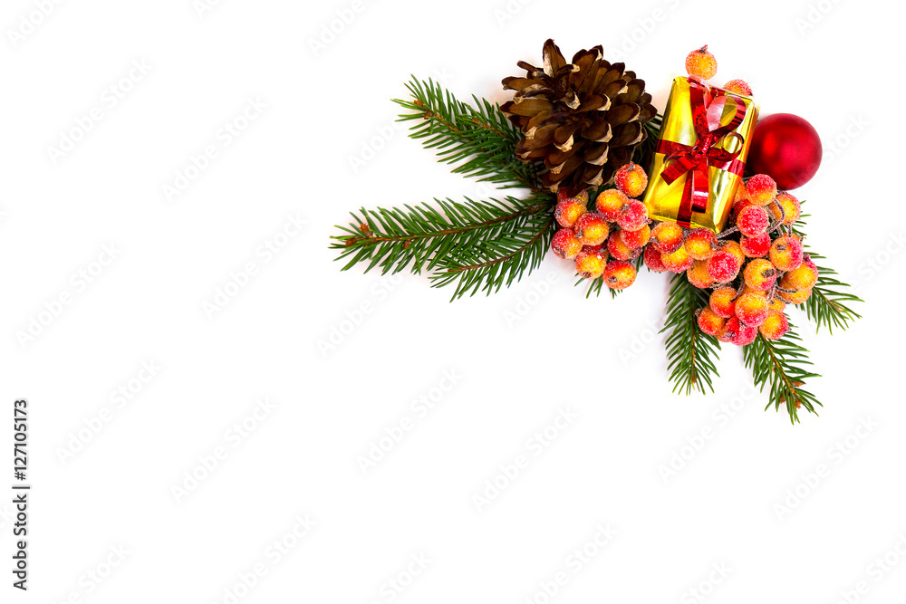 Christmas decoration with branch of christmas tree, gift box, christmas berries, cone pine and Christmas toy on white background with space for text. Top view, flat lay