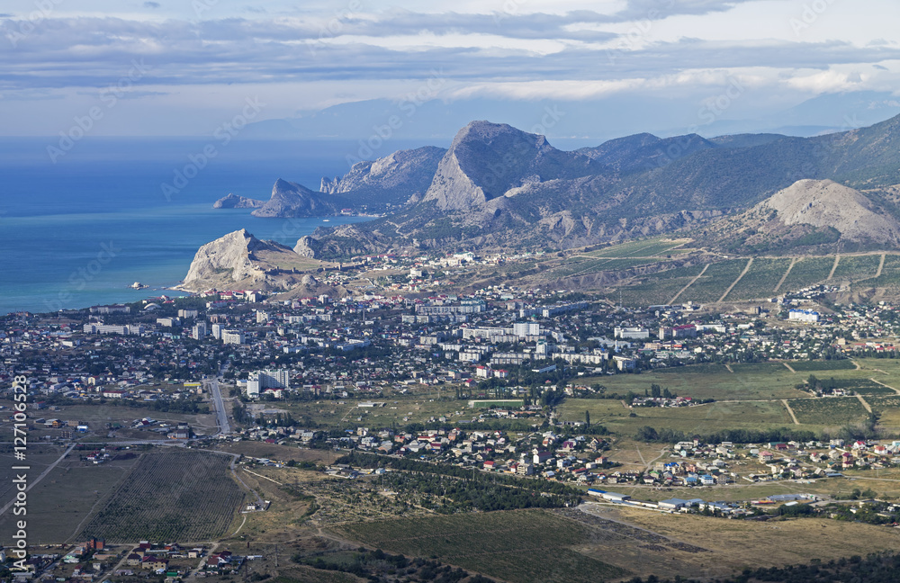 Panorama of a small resort town in Crimea from the top of the mo