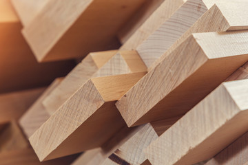 Wood timber construction material for background and texture. close up. Stack of wooden bars. small depth of field