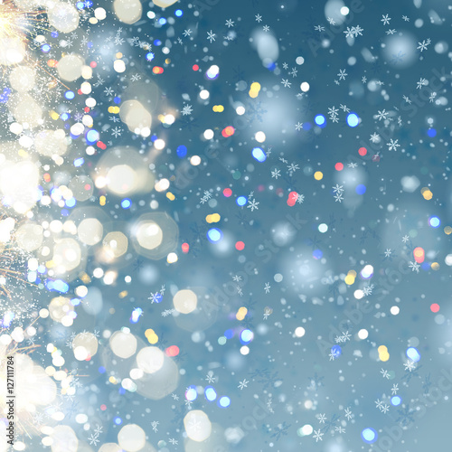 blue christmas and new years snow background with colorful bokeh