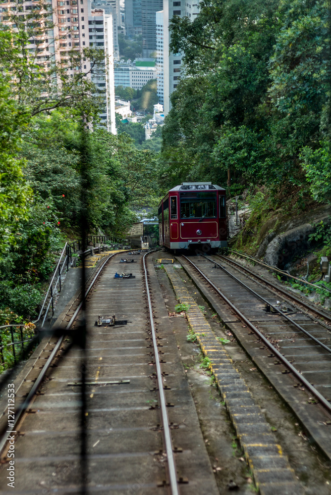 Tram approaching on the Victoria Peak in Hong Kong Tram approaching on the Victoria Peak in Hong Kong